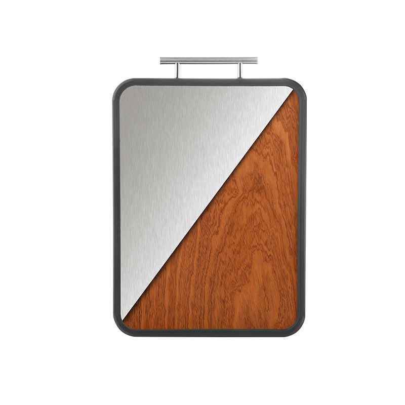 Dual-sided titanium ebony cutting board showcasing a sleek metallic surface and natural wood grain for versatile kitchen use.